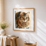 Portrait of a brown tabby cat cross stitch artwork displayed on wall as home decor