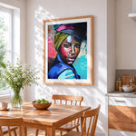 Portrait of a woman with headwrap cross stitch artwork displayed on wall as home decor