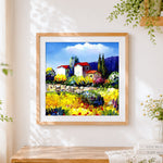 Finished post impressionist village cross stitch artwork displayed