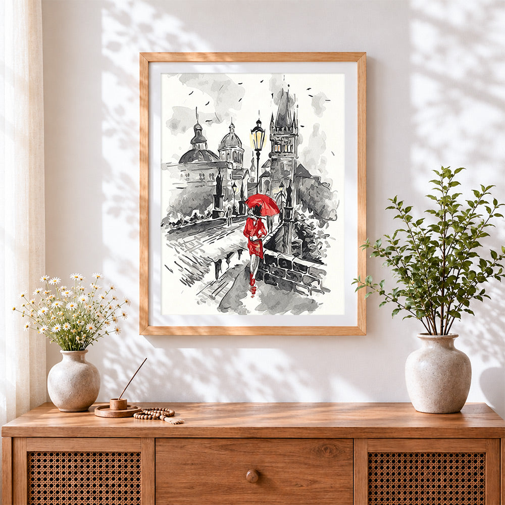 Finished prague charles bridge and woman cross stitch artwork displayed