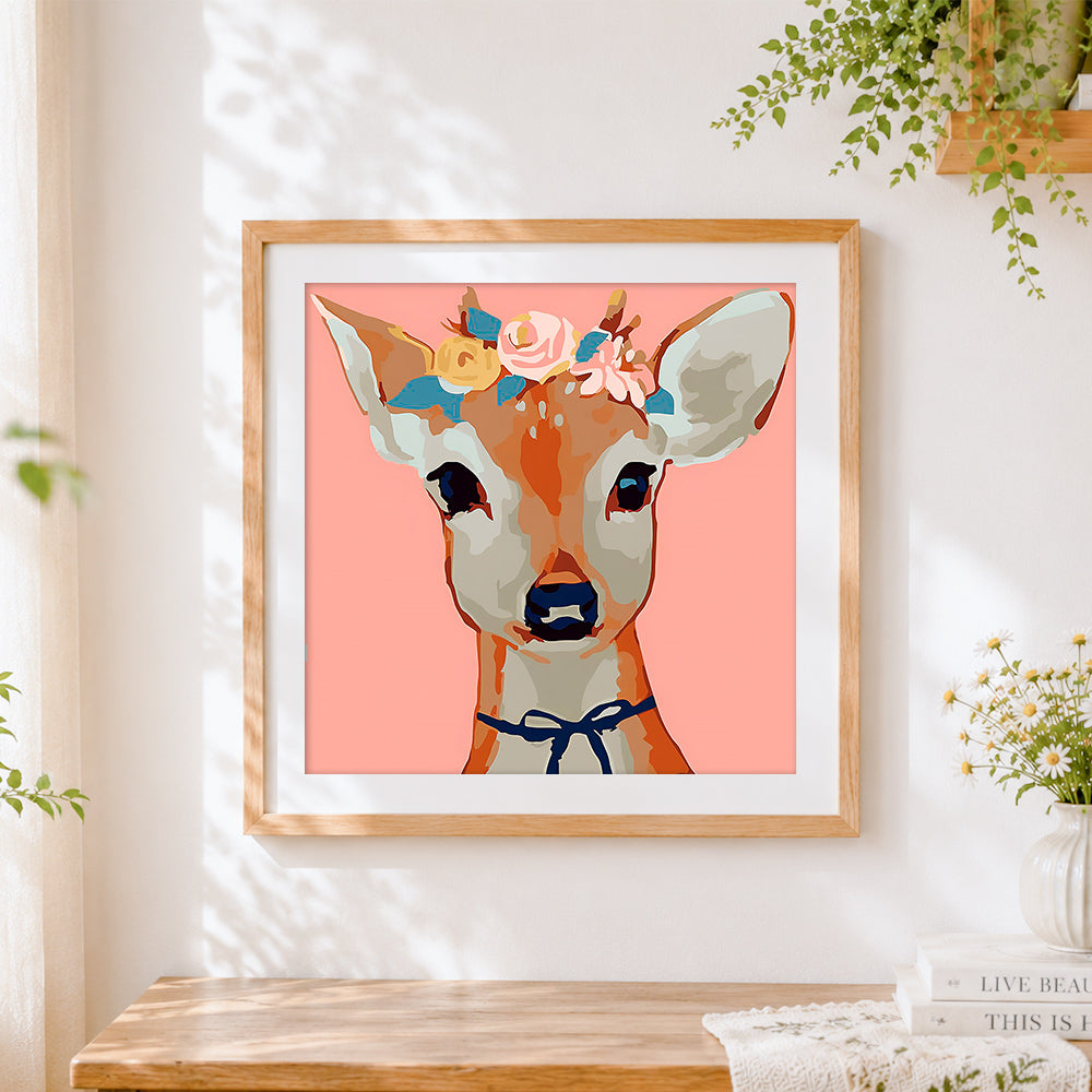 Finished pretty floral deer cross stitch artwork displayed