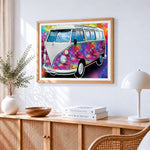Psychedelic colourful camper van cross stitch artwork displayed on wall as home decor
