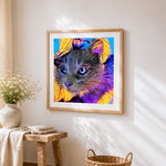 Psychedelic colourful cat portrait cross stitch artwork displayed on wall as home decor