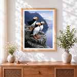 Finished puffins on cliff cross stitch artwork displayed
