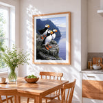 Puffins on cliff cross stitch artwork displayed on wall as home decor