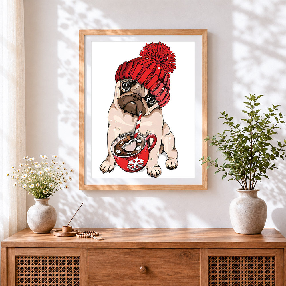 Finished pug in a bobble hat with hot chocolate cross stitch artwork displayed
