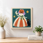 Finished pumpkin bride with black cat artwork displayed on a wall