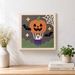Finished pumpkin hot air balloon artwork displayed on a wall