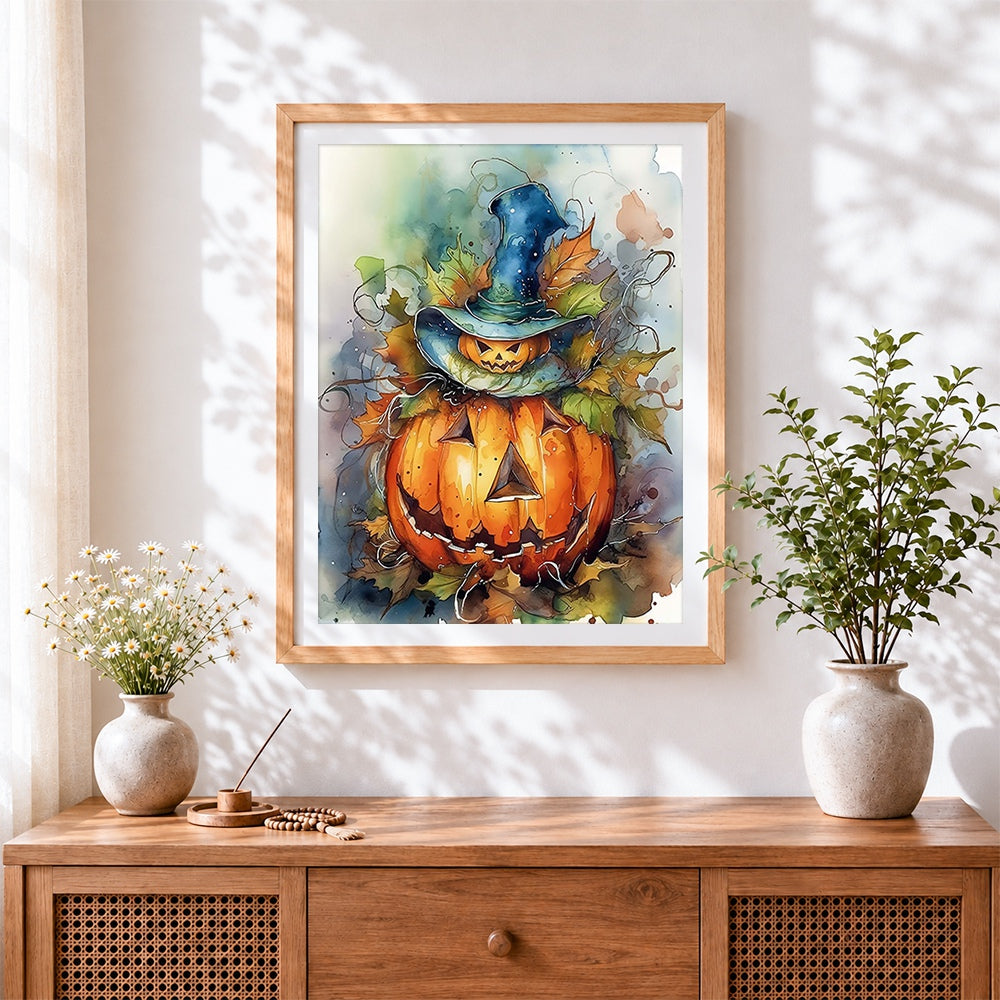 Finished pumpkin in witch hat cross stitch artwork displayed