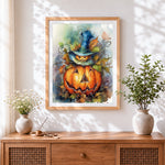 Finished pumpkin in witch hat cross stitch artwork displayed