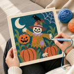 Creating handmade pumpkin patch scarecrow punch needle artwork