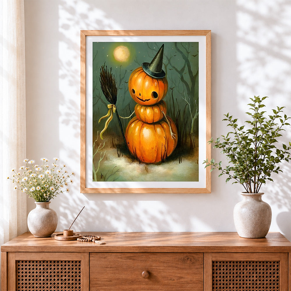 Finished pumpkin snowman with witch hat and broom cross stitch artwork displayed
