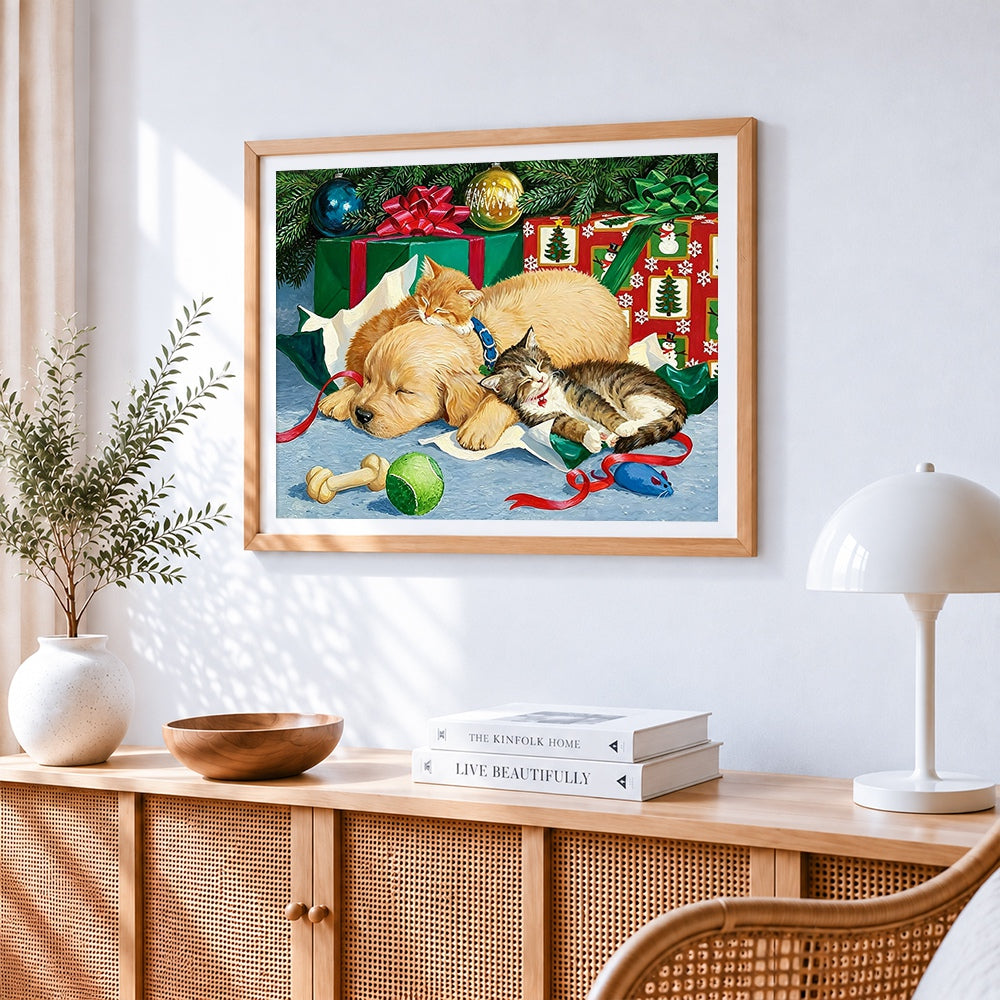 Puppies and kittens sleeping by gifts cross stitch artwork displayed on wall as home decor