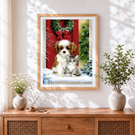 Finished puppy and kitten by a red door with christmas wreath cross stitch artwork displayed