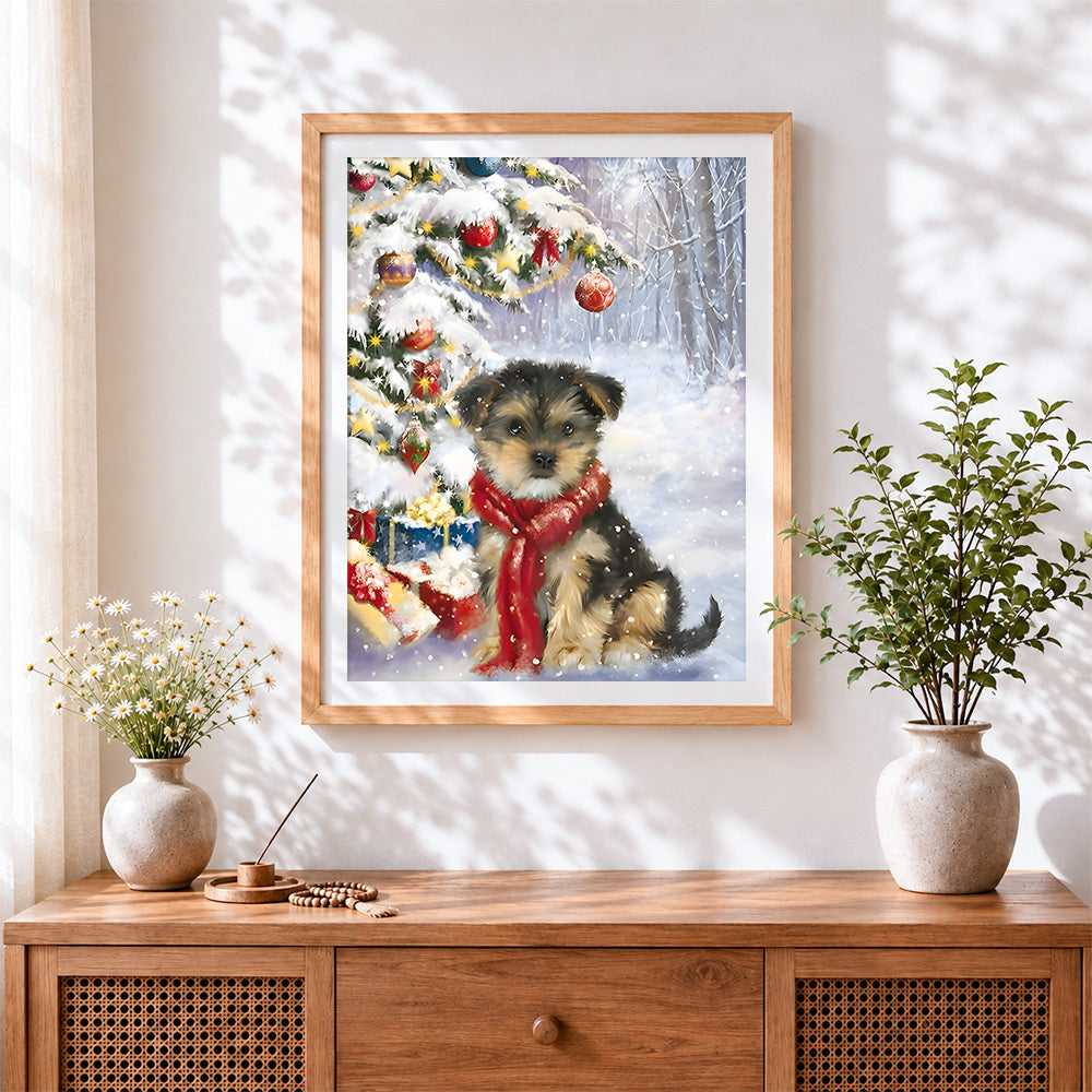 Finished puppy in red scarf by a snowy christmas tree cross stitch artwork displayed