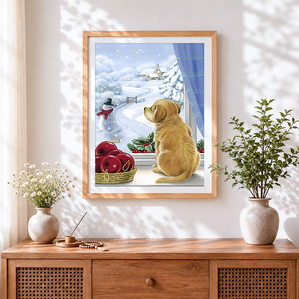 Finished puppy looking at a snowy window cross stitch artwork displayed