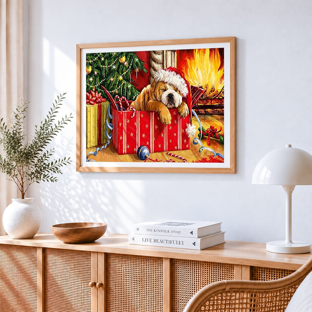 Puppy sleeping in a gift box cross stitch artwork displayed on wall as home decor