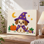Puppy witch for halloween punch needle artwork displayed on a table