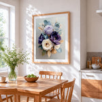 Purple and cream floral bouquet cross stitch artwork displayed on wall as home decor