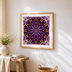Purple and gold kaleidoscope mandala cross stitch artwork displayed on wall as home decor