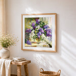 Purple and white lilacs in a vase cross stitch artwork displayed on wall as home decor
