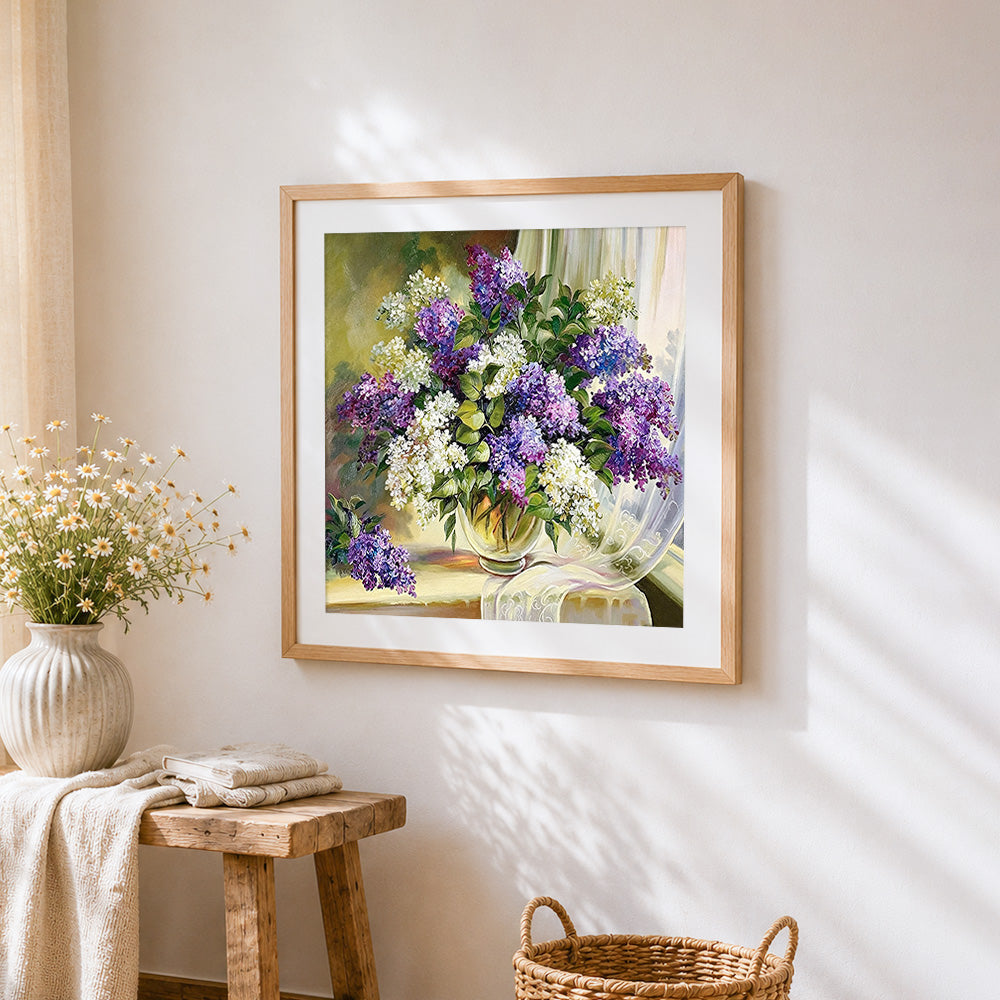 Purple and white lilacs in a vase cross stitch artwork displayed on wall as home decor