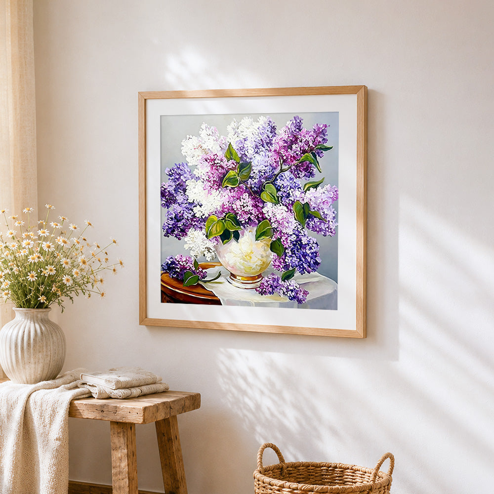 Purple and white lilacs still life cross stitch artwork displayed on wall as home decor