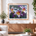 Finished purple and white lilies cross stitch artwork displayed