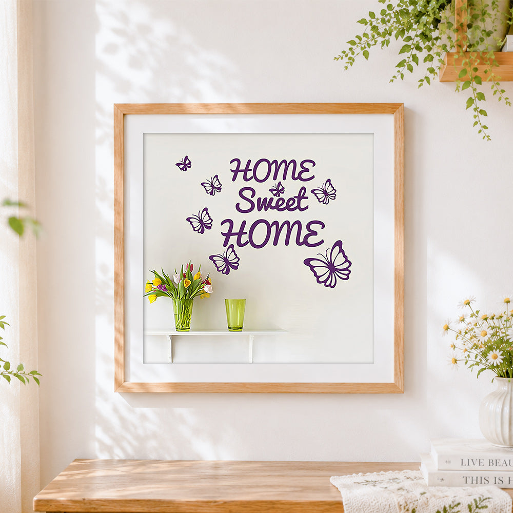 Finished purple butterflies and home sweet home sign cross stitch artwork displayed