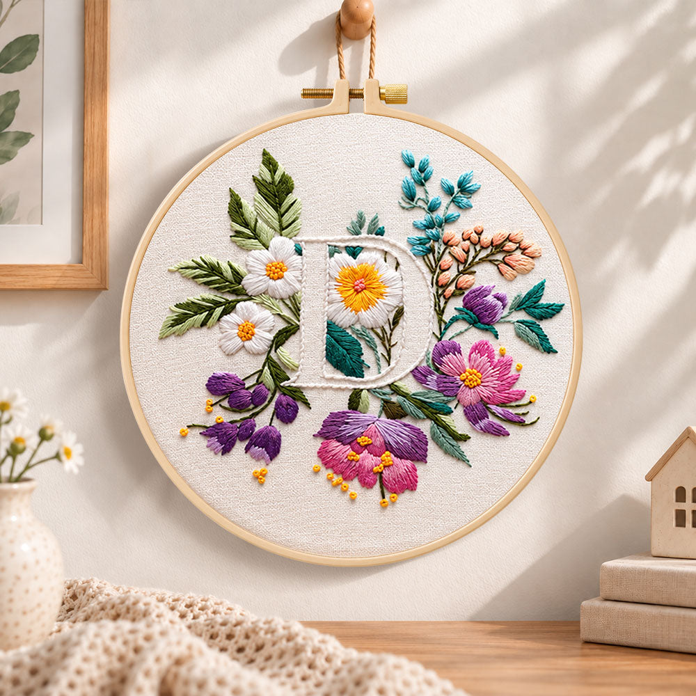 Purple daisy garden and letter d embroidery hoop wall art displayed as warm and cosy handmade home decor