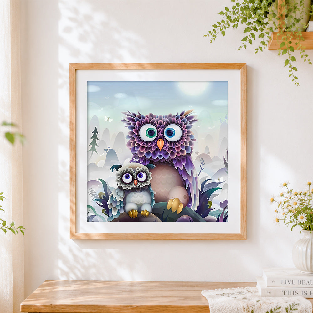 Finished purple fantasy owl and baby cross stitch artwork displayed