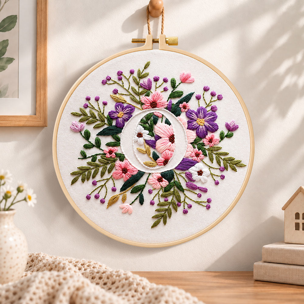 Purple floral ring and letter o embroidery hoop wall art displayed as warm and cosy handmade home decor