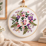 Purple floral ring and letter o embroidery hoop wall art displayed as warm and cosy handmade home decor