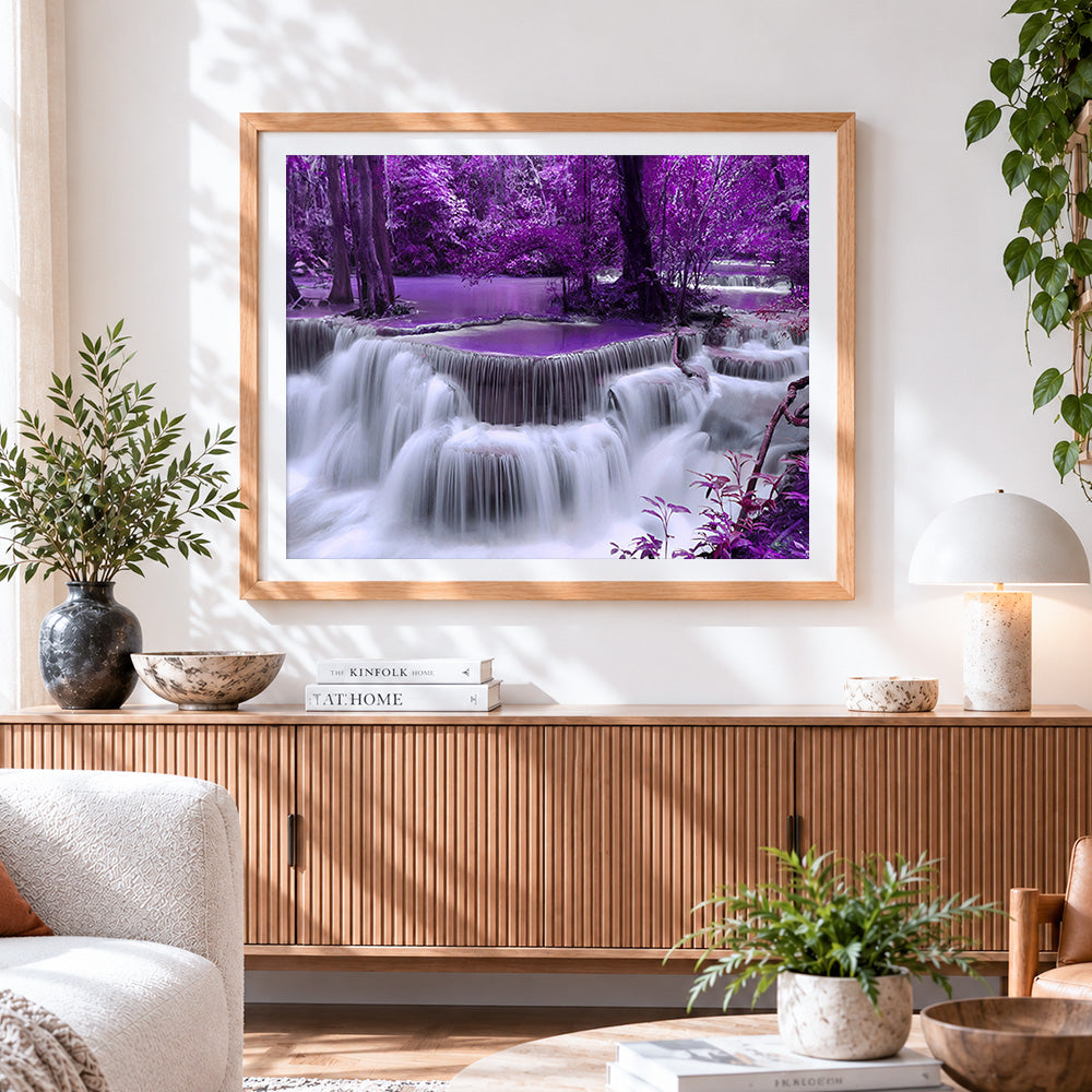 Finished purple forest waterfall cross stitch artwork displayed