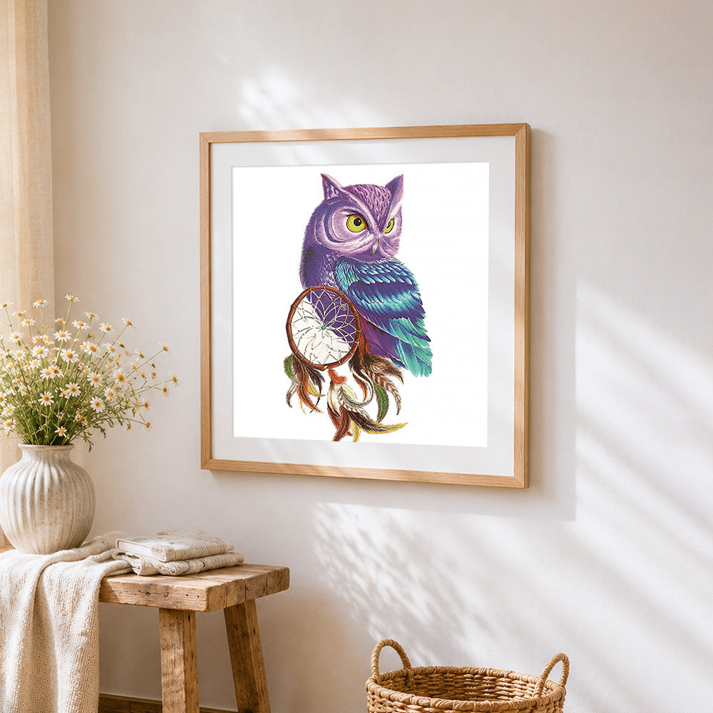 Purple owl with dreamcatcher cross stitch artwork displayed on wall as home decor