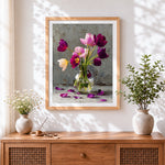 Finished purple tulips in a glass vase cross stitch artwork displayed