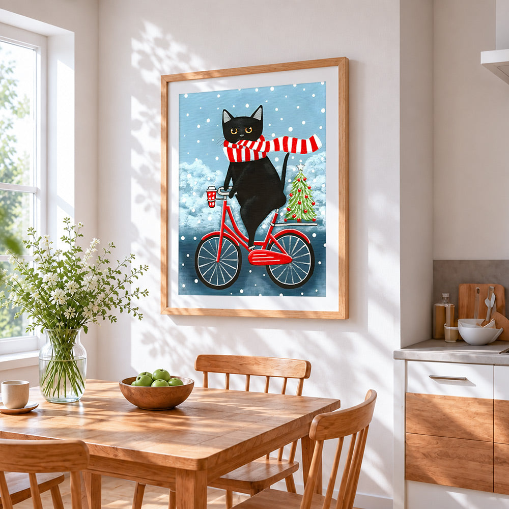 Quirky black cat on bicycle cross stitch artwork displayed on wall as home decor
