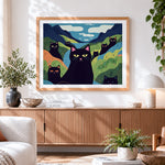 Finished quirky black cats in a colourful valley cross stitch artwork displayed