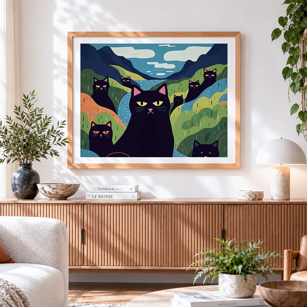 Finished quirky black cats in a colourful valley cross stitch artwork displayed