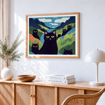 Quirky black cats in a colourful valley paint by numbers artwork displayed on wall as home decor