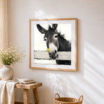 Quirky donkey with a yellow flower cross stitch artwork displayed on wall as home decor