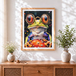 Finished quirky frog with glasses and toadstool cross stitch artwork displayed