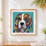 Finished rainbow beagle portrait cross stitch artwork displayed