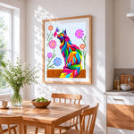 Rainbow cat watching a butterfly cross stitch artwork displayed on wall as home decor