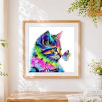 Finished rainbow cat with a colourful butterfly paint by numbers artwork displayed as home decor