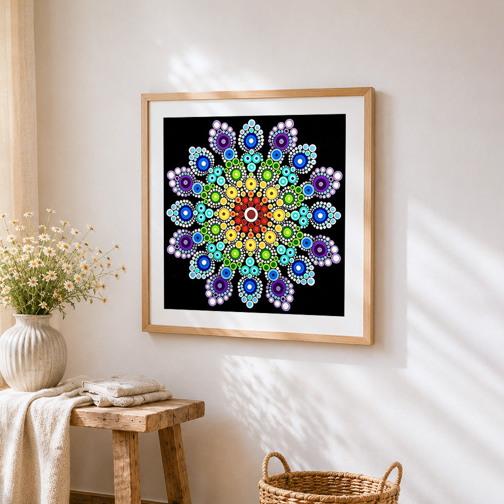 Rainbow dot mandala cross stitch artwork displayed on wall as home decor