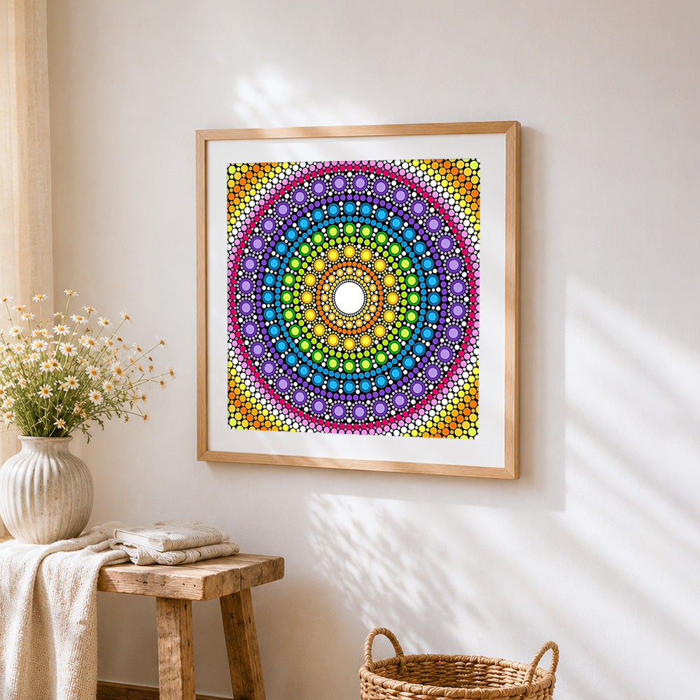Rainbow dot mandala with white centre cross stitch artwork displayed on wall as home decor