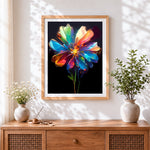 Finished rainbow glass flower cross stitch artwork displayed