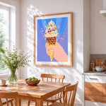 Rainbow ice cream cone with confetti cross stitch artwork displayed on wall as home decor