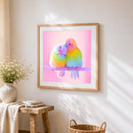 Rainbow parakeets in love cross stitch artwork displayed on wall as home decor
